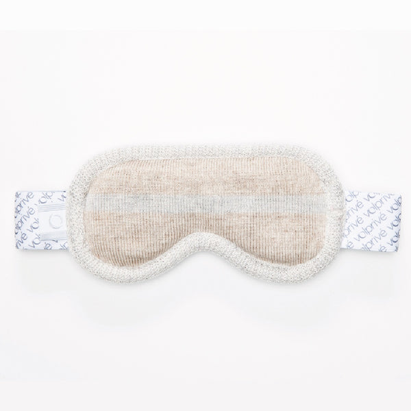 Masque de sommeil beige en forme de lunette de ski laine mérinos / Sleep mask shaped like a ski goggle in merino wool beige made in Canada.