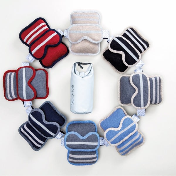 Assortiment d'oreillers de voyage et masques assortis en laine de mérinos avec sac de transport/ Assortment of travel pillows and assorted sleep masks made in Canada with travel bag by Volprivé.