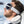 Homme d'affaire assis côté hublot avec masque et oreiller bleu marine / Business man sitting in a plane window seat wearing a sleep mask and travel pillow navy blue by Volprivé.